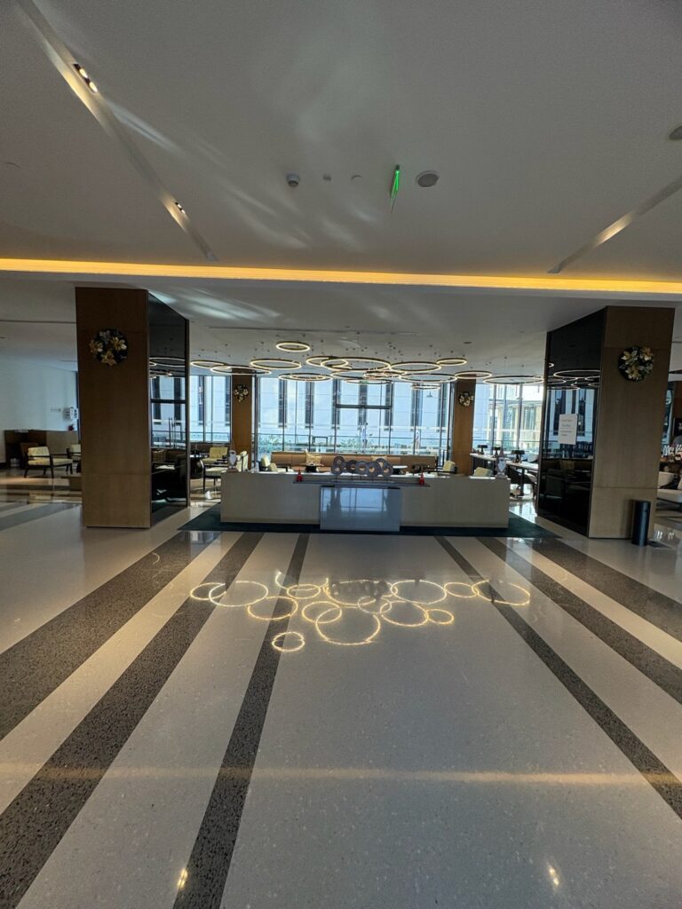 Spacious modern lobby seating area at Hilton Garden Inn Manyata.