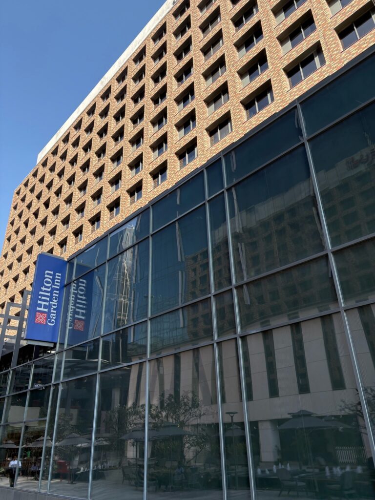 Exterior view of Hilton Garden Inn Bengaluru Embassy Manyata Business Park building.