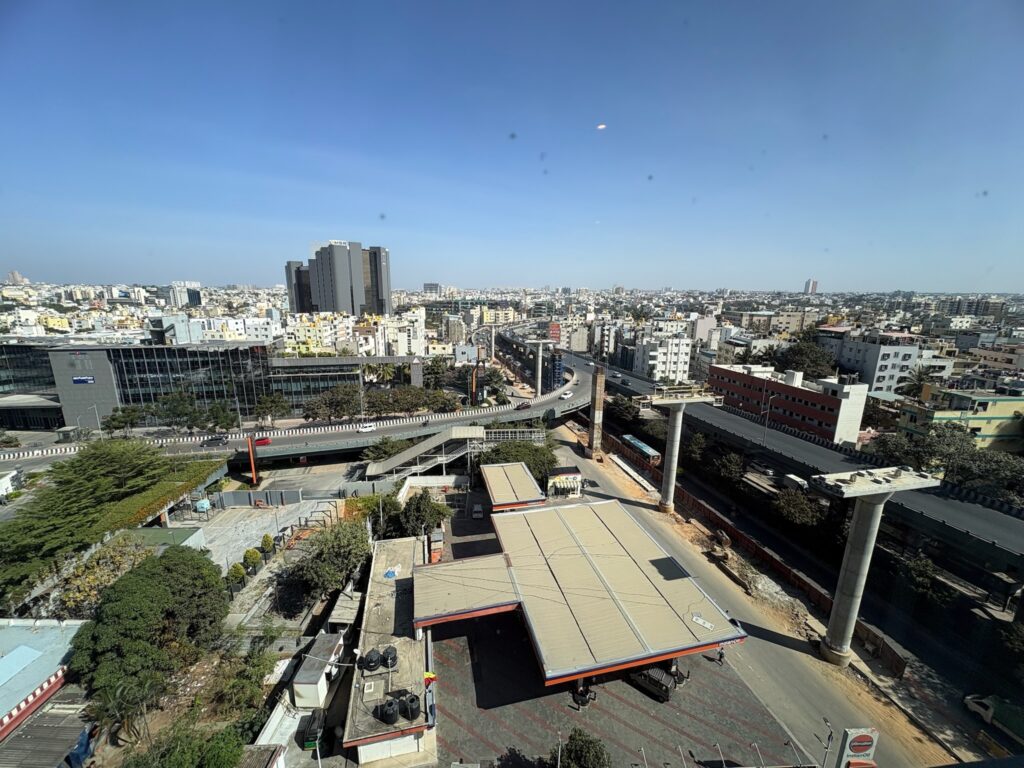 City view of Bangalore flyovers and infrastructure from Hilton Garden Inn room window.