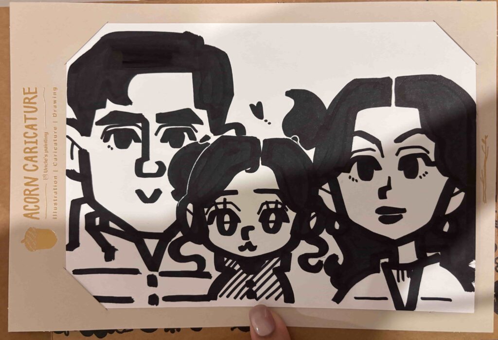 A hand-drawn family caricature from Hongdae Seoul—our favorite sentimental souvenir from our South Korea shopping guide