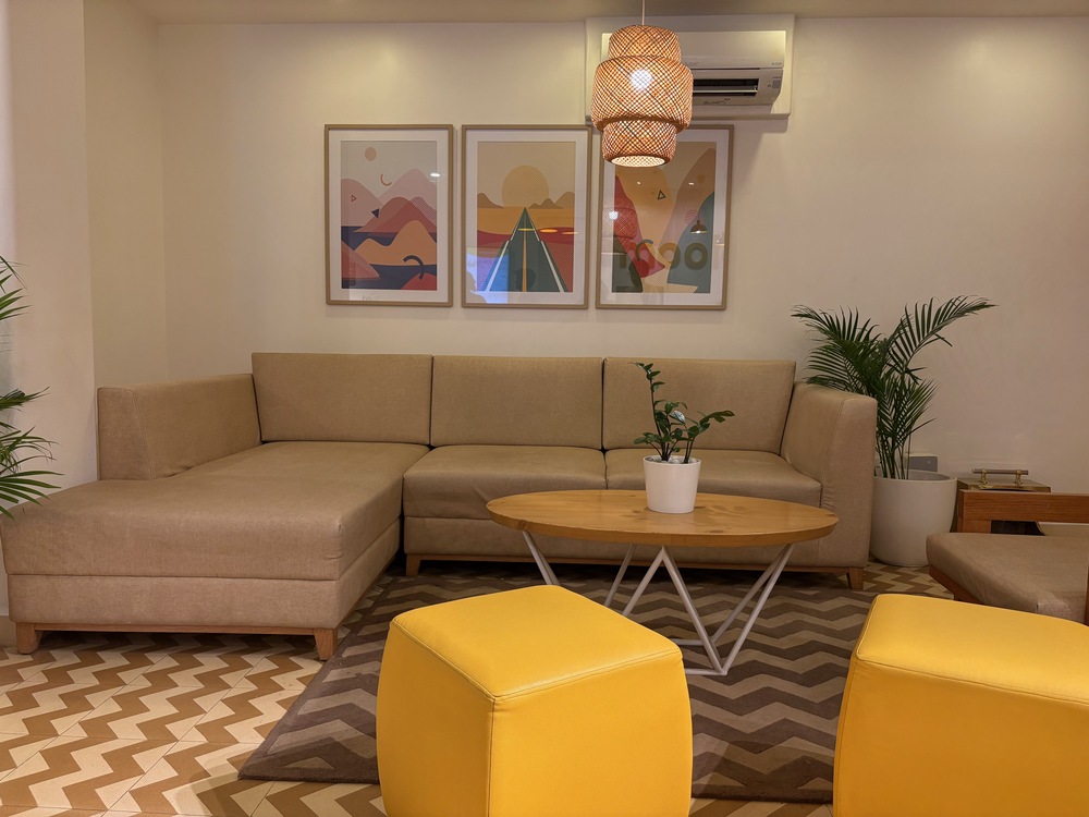 Bright yellow lobby decor and cozy seating area at Bloom Hotel Brookefield