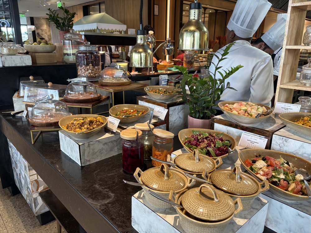 Live kitchen counter salad and main course spread at Cosmo Restaurant 3rd floor