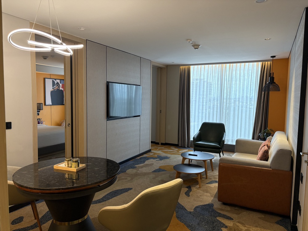 Generous family living room seating space inside the upgraded suite during a Hyatt Centric Hebbal staycation