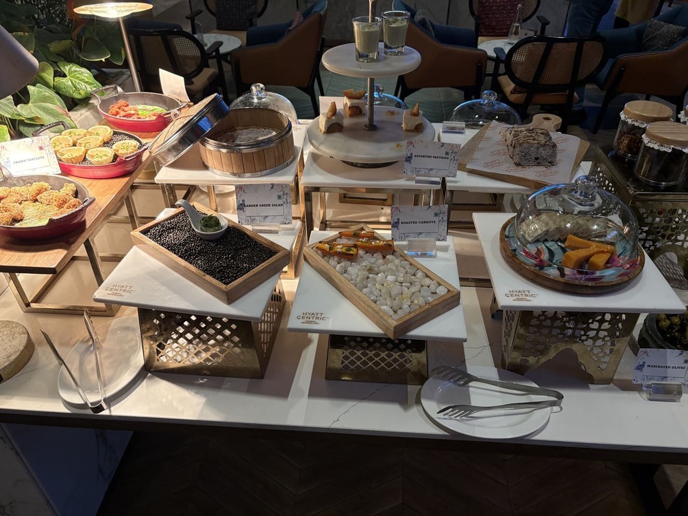 Evening executive lounge mini buffet food setup and complimentary snacks at Hyatt Centric Hebbal